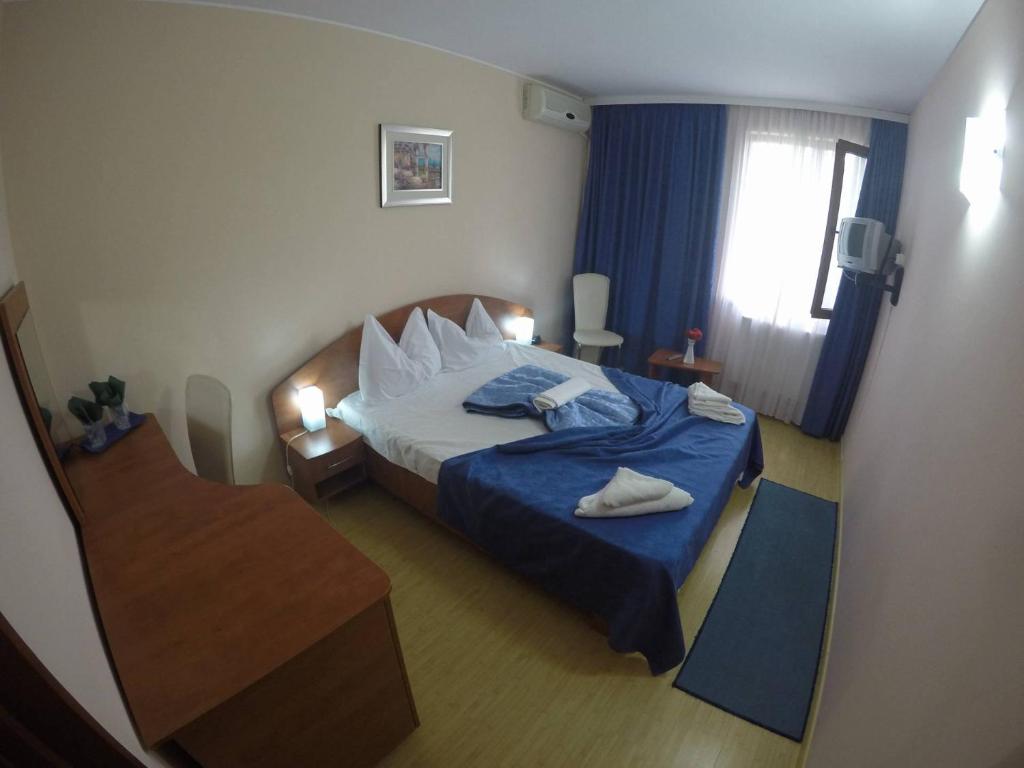 Postel nebo postele na pokoji v ubytování Hotel Turist