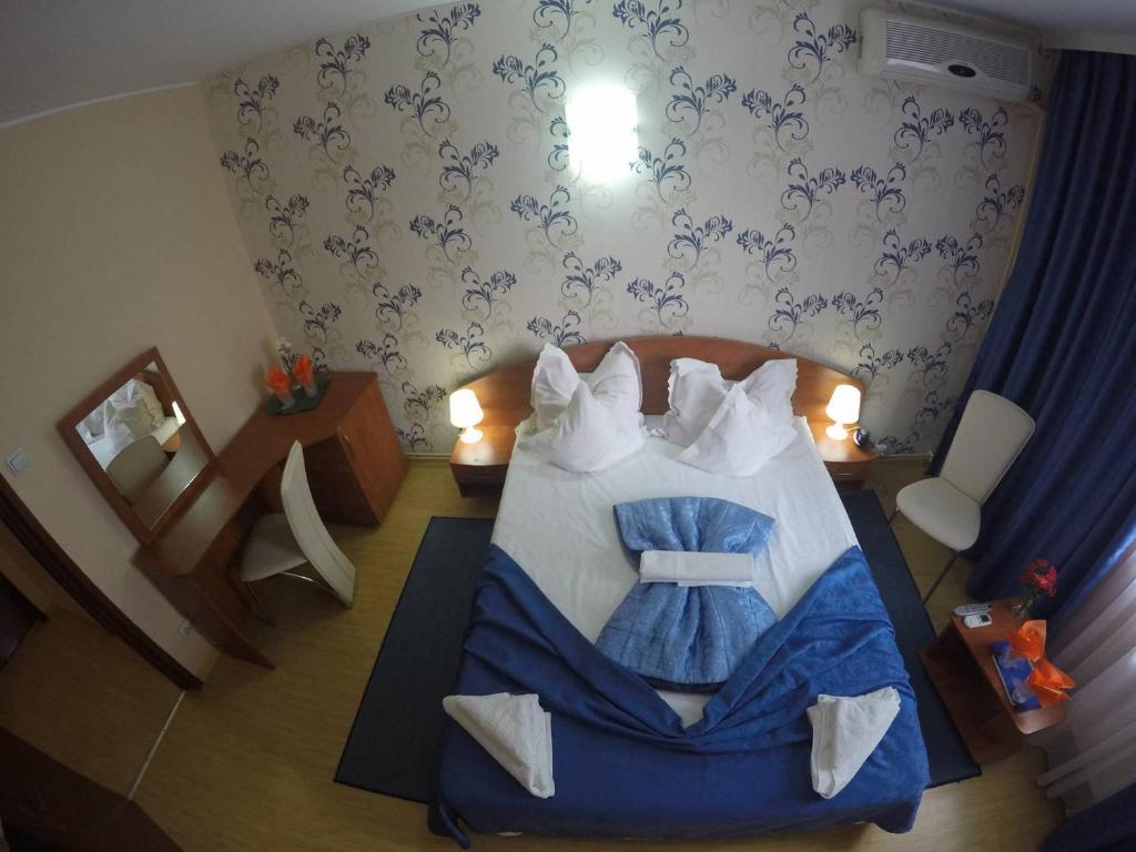 Postel nebo postele na pokoji v ubytování Hotel Turist