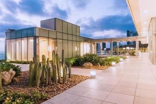 a large building with cactuses in front of it at Cartagena Colombia- h2 Hyatt condo-Bay view in Cartagena de Indias