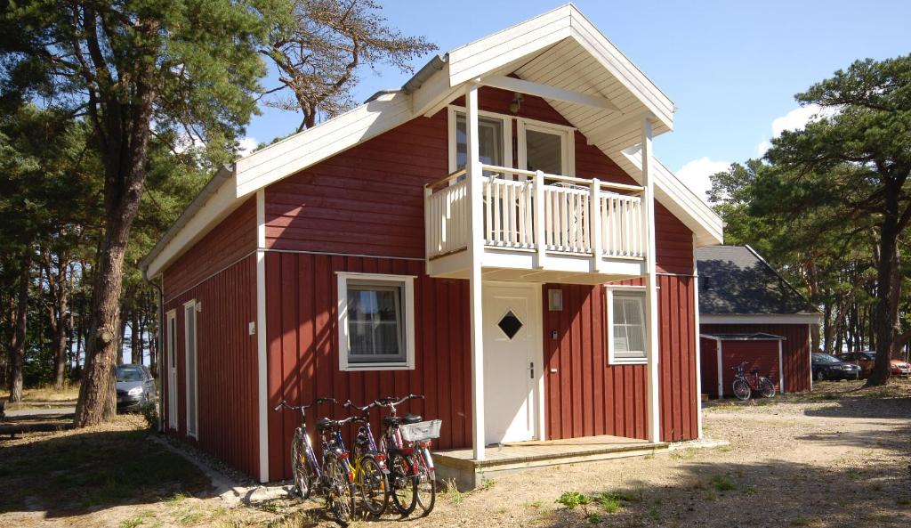 a red building with bikes parked outside of it at Ferienhaus Baabe in Baabe
