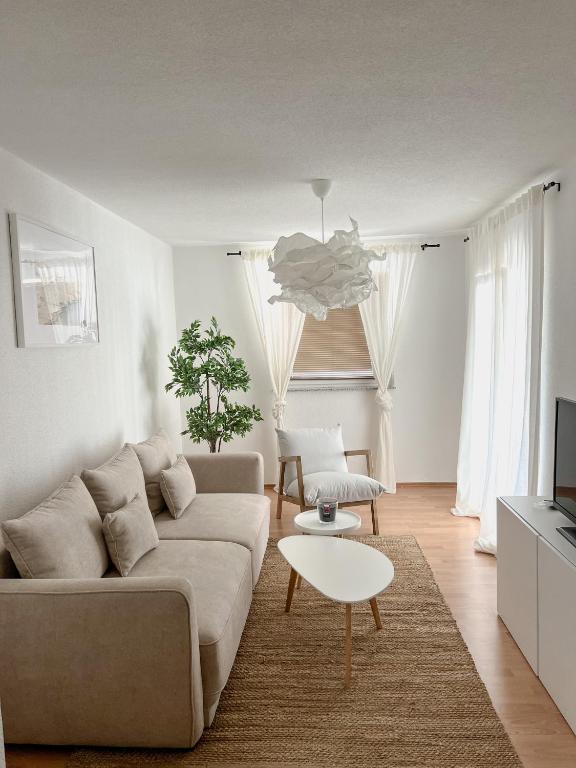 a living room with a couch and a table at Lúmina Vir in Vir