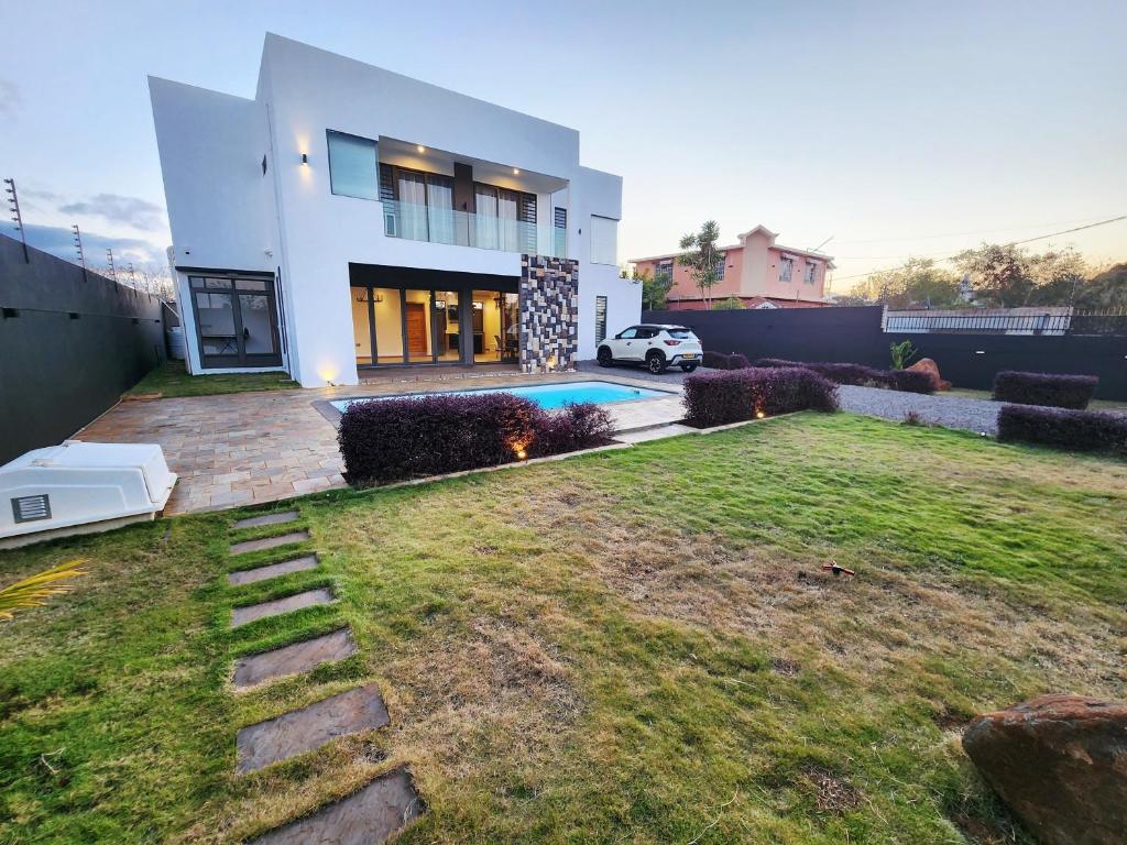 a house with a yard in front of it at VLAP Residence in Terre Rouge