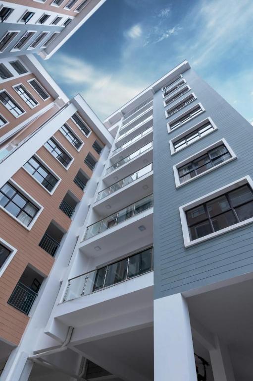 a view of a building from the bottom at Elevate Your Living Experience in zameen Opal Apartments in Lahore