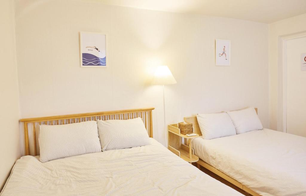 Ένα ή περισσότερα κρεβάτια σε δωμάτιο στο NOOKS, Seoul Sadang, Local sensibility of Korea