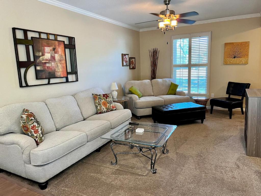 a living room with a couch and a table at Mins to Blessing Hospital, Miss River, Country Club in Quincy