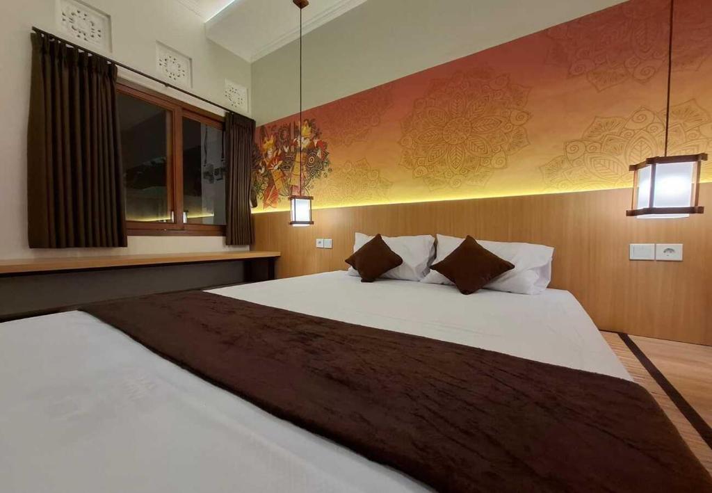 Кровать или кровати в номере Mandala Living