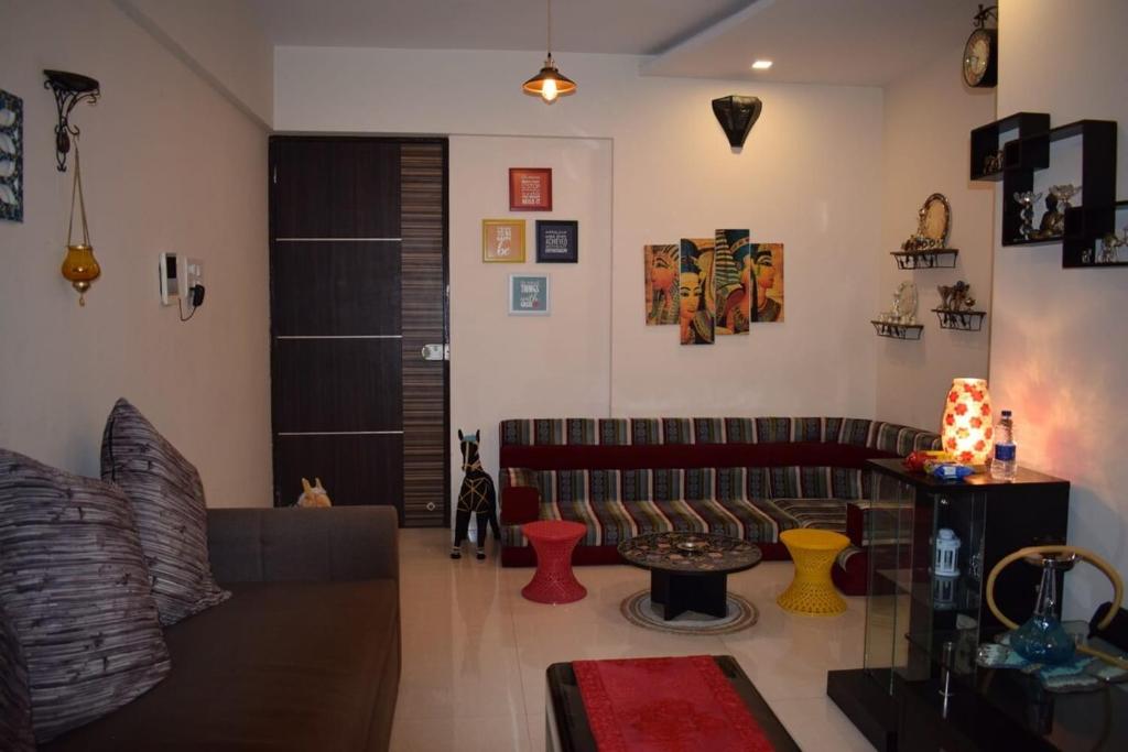 a living room with a couch and a table at Apartment for Work Personal use in Mire