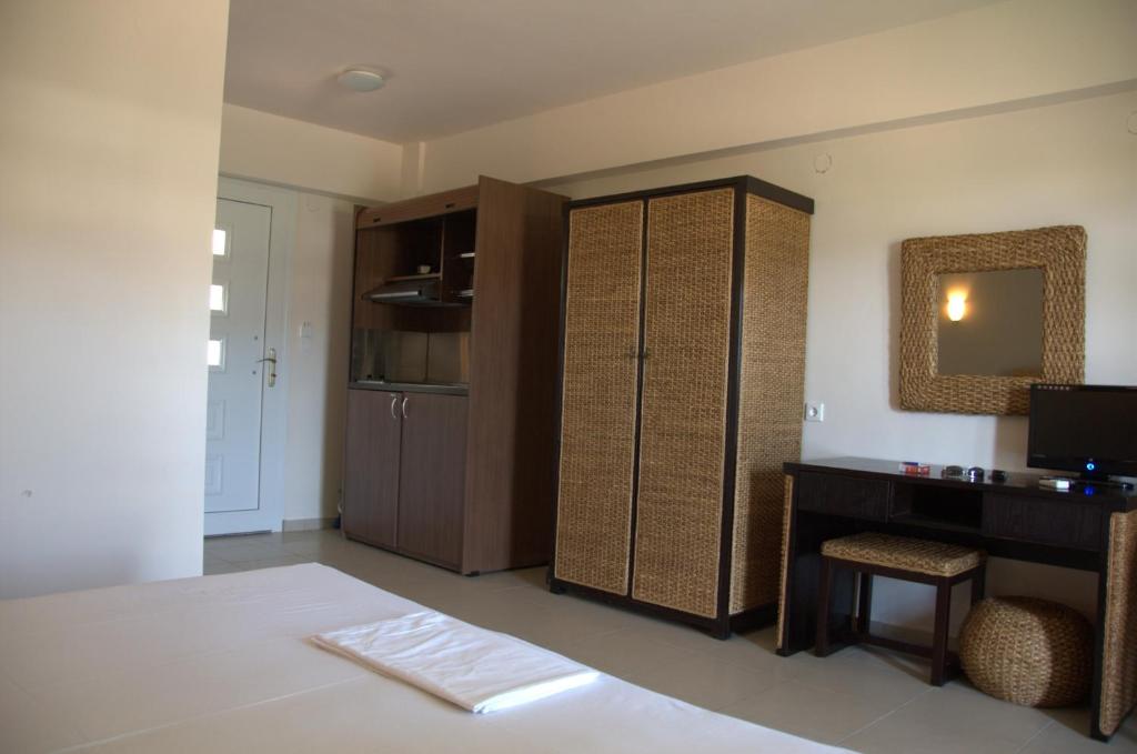 Postel nebo postele na pokoji v ubytování Hotel Sarti Beach