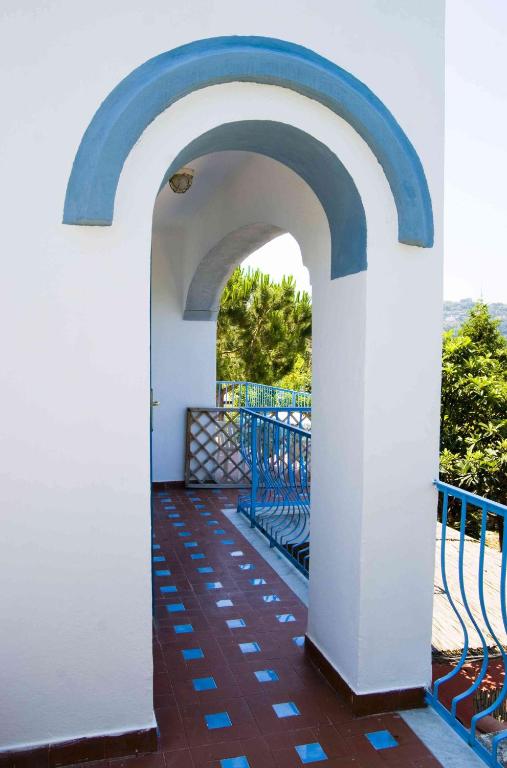 an archway on the balcony of a house at Aparthotel Villa Marinù in Ischia