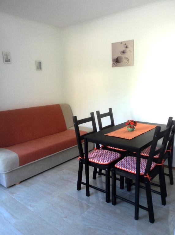Posedenie v ubytovaní Apartments Karoma