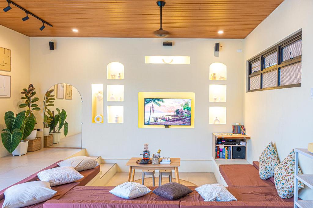 a living room with a couch and a table at Casa Dapyo in Sampong