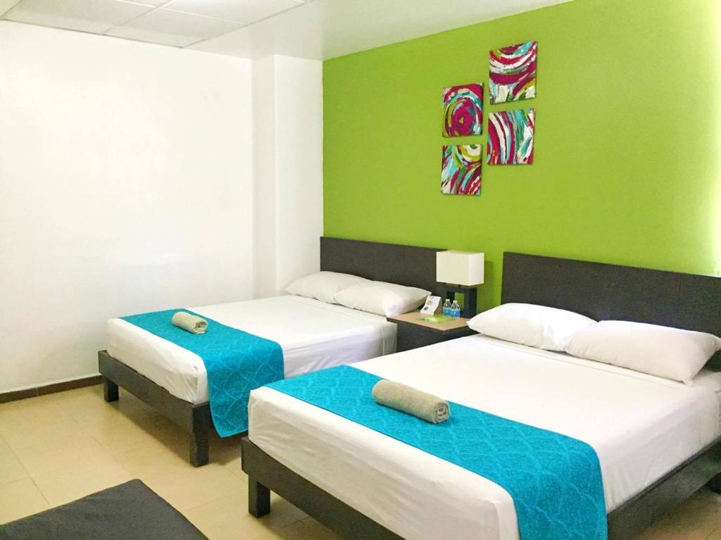 Säng eller sängar i ett rum på Hotel Plazha