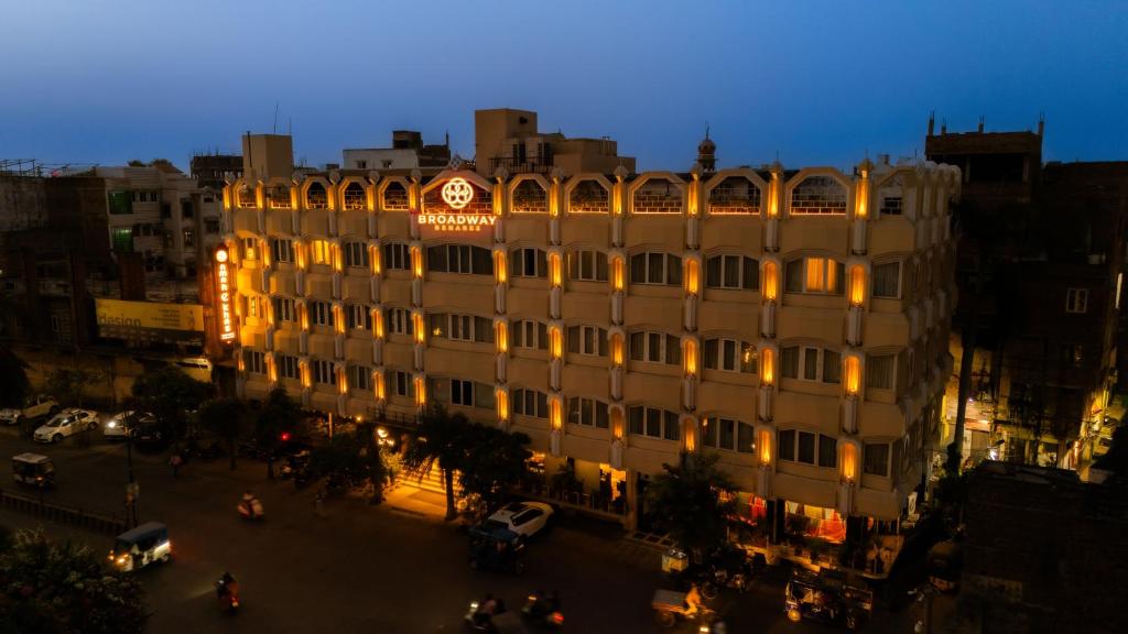 a building with a clock on the side of it at New Hotel Broadway in Varanasi