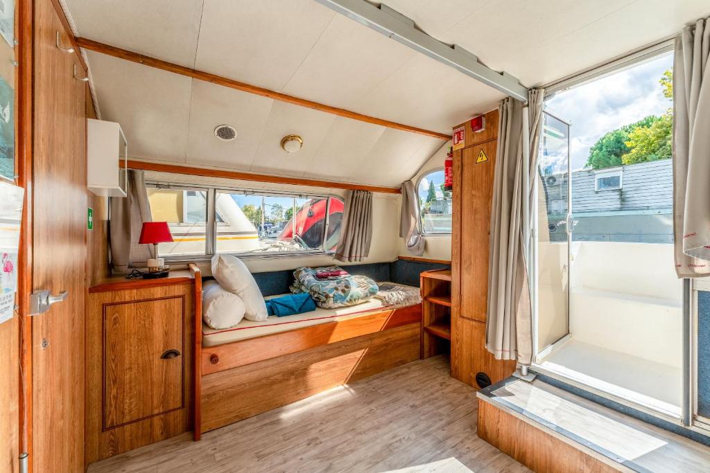 a view of the inside of a recreational vehicle with a window at Penichette Odyssey Croisieres in Bellegarde