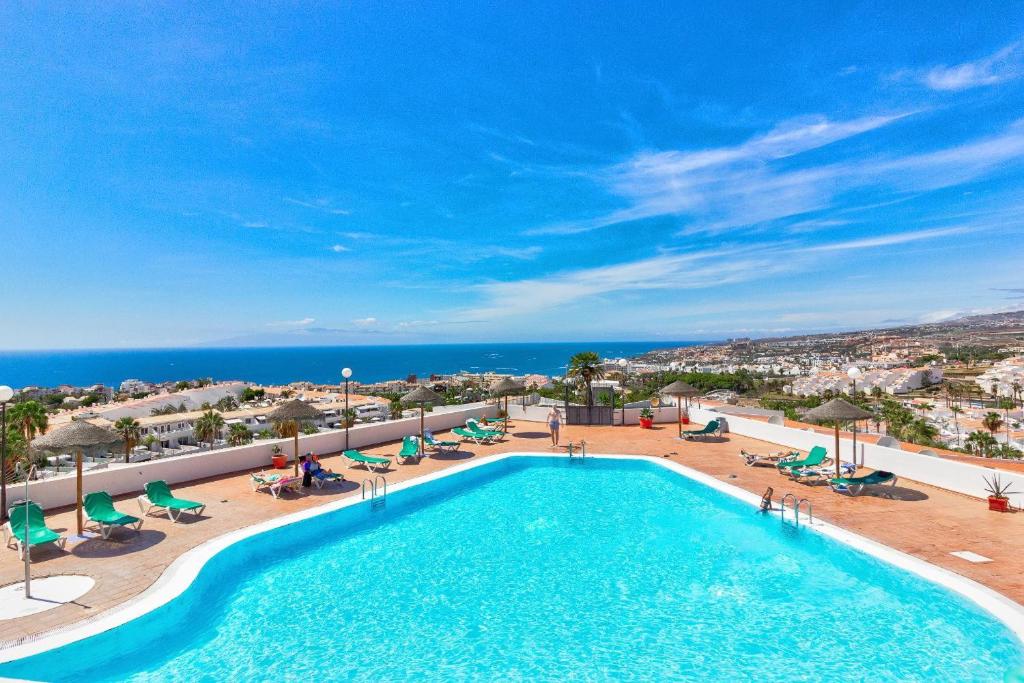 a swimming pool with a view of the ocean at Panoramic Ocean Mountain View 3 in Adeje