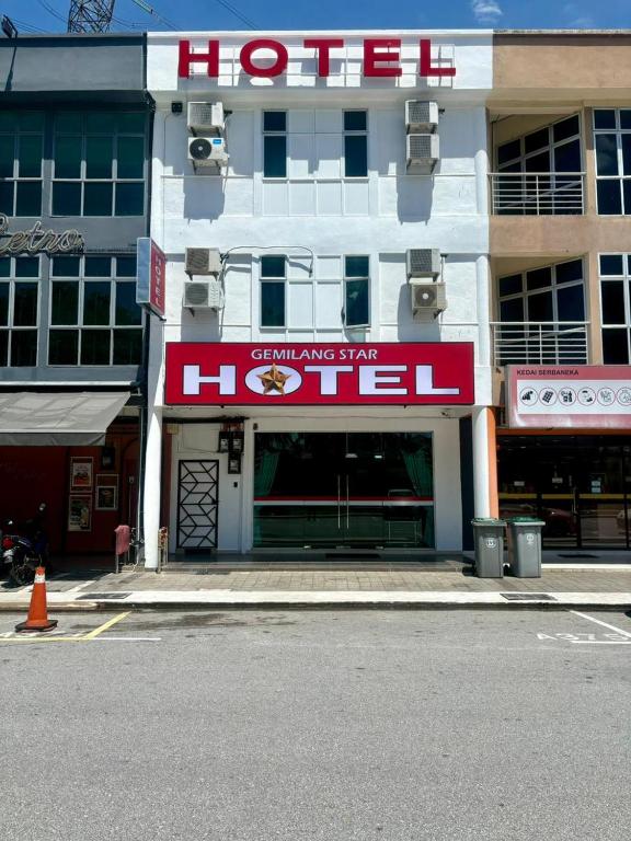 a hotel with a sign on the side of a street at Gemilang Star Hotel in Port Dickson
