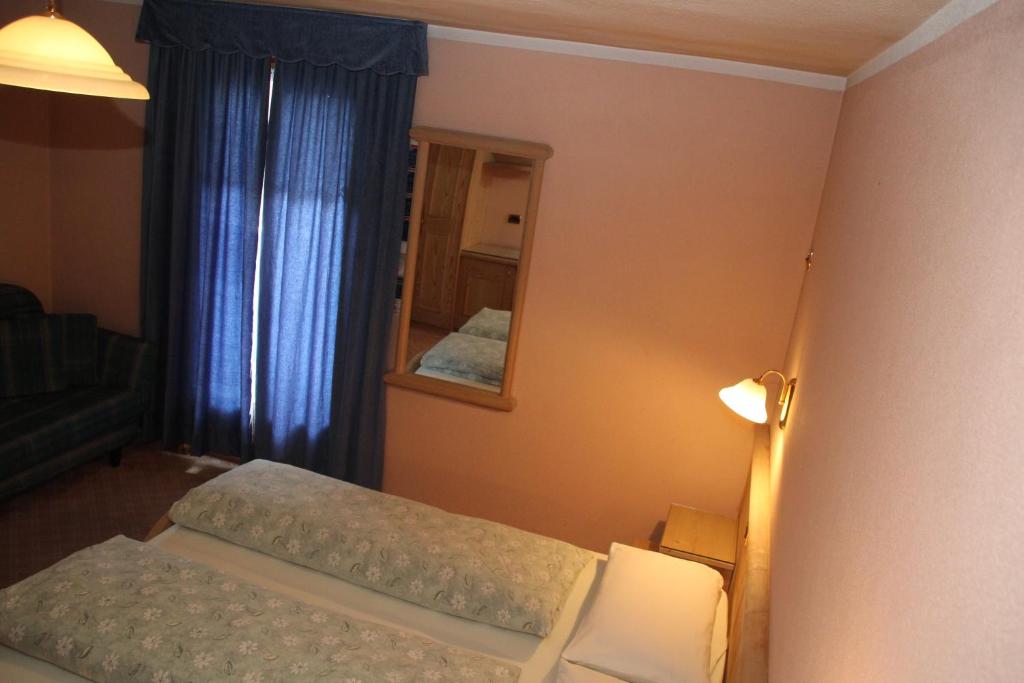 Postel nebo postele na pokoji v ubytování Albergo Caravasc