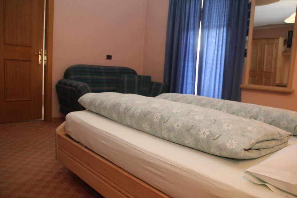 Postel nebo postele na pokoji v ubytování Albergo Caravasc