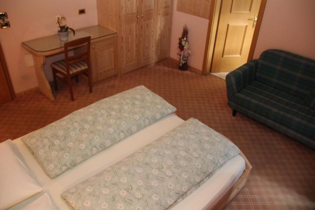 Postel nebo postele na pokoji v ubytování Albergo Caravasc