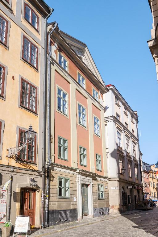 a large building on the side of a street at At Old Town Aparthotel in Stockholm