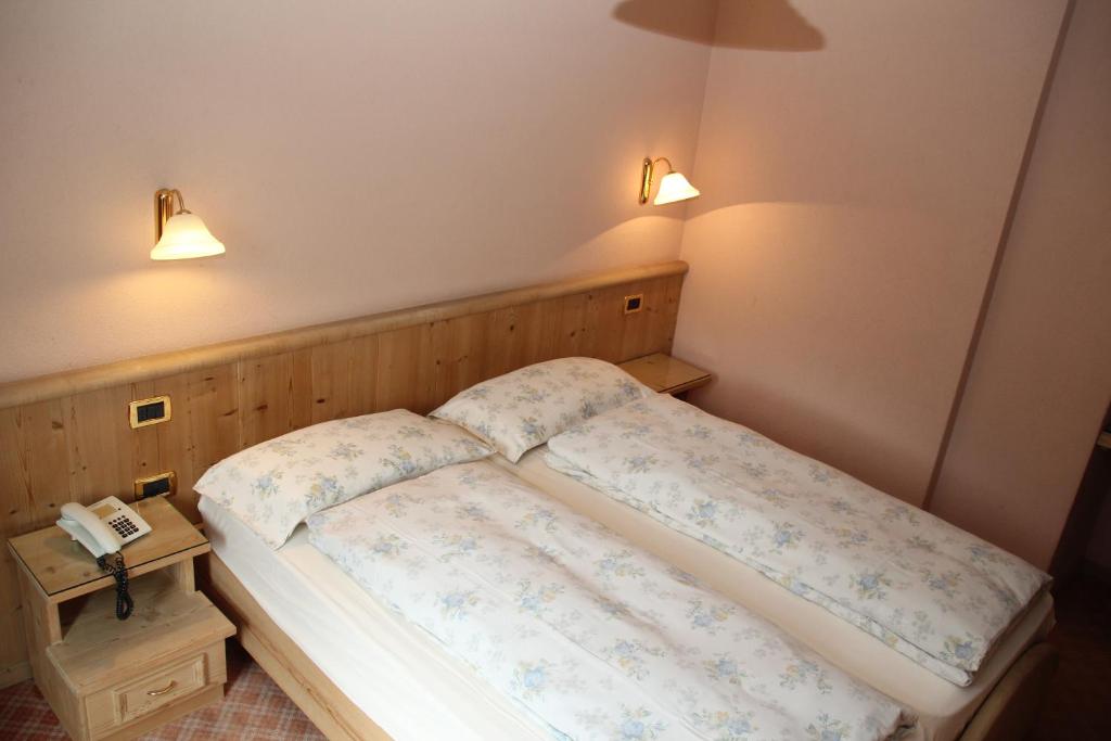 Postel nebo postele na pokoji v ubytování Albergo Caravasc
