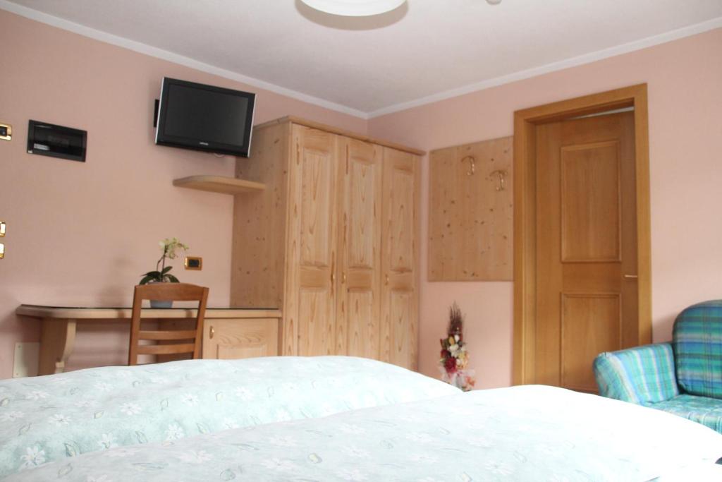 Postel nebo postele na pokoji v ubytování Albergo Caravasc