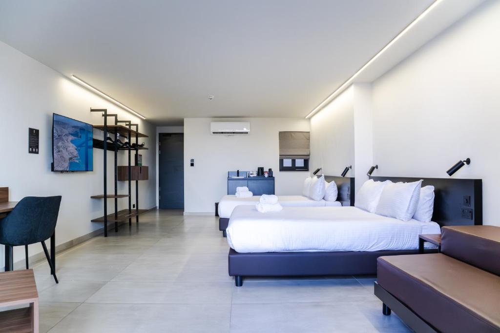 Ένα ή περισσότερα κρεβάτια σε δωμάτιο στο Onyx Hotel