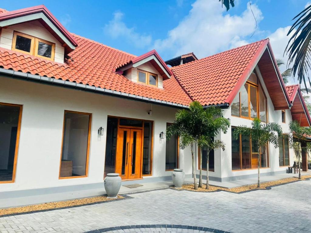 a house with an orange roof at Turtle bay view private villa in Liyanegoda