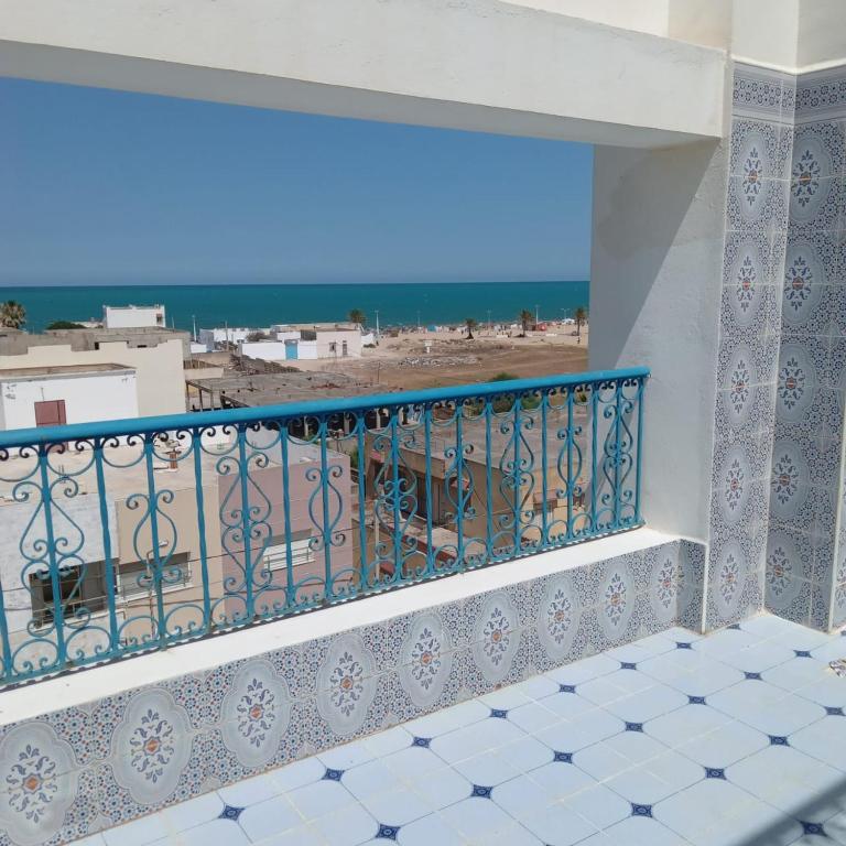 a balcony with a view of the beach at Seaview Apartments in Raoued