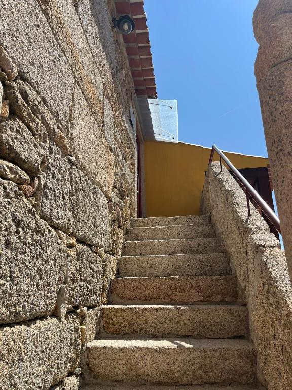 a set of stairs leading up to a building at Casa da Saboaria in Almeida