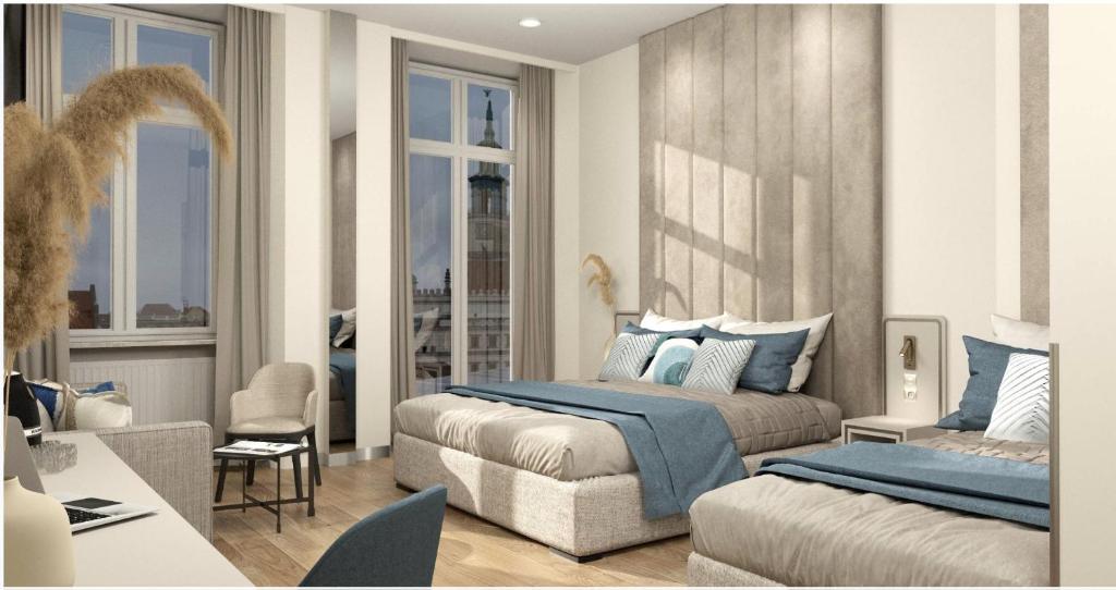 a bedroom with a bed and a couch at Oysters & Bubbles Gastro Rooms Rynek Square in Poznań