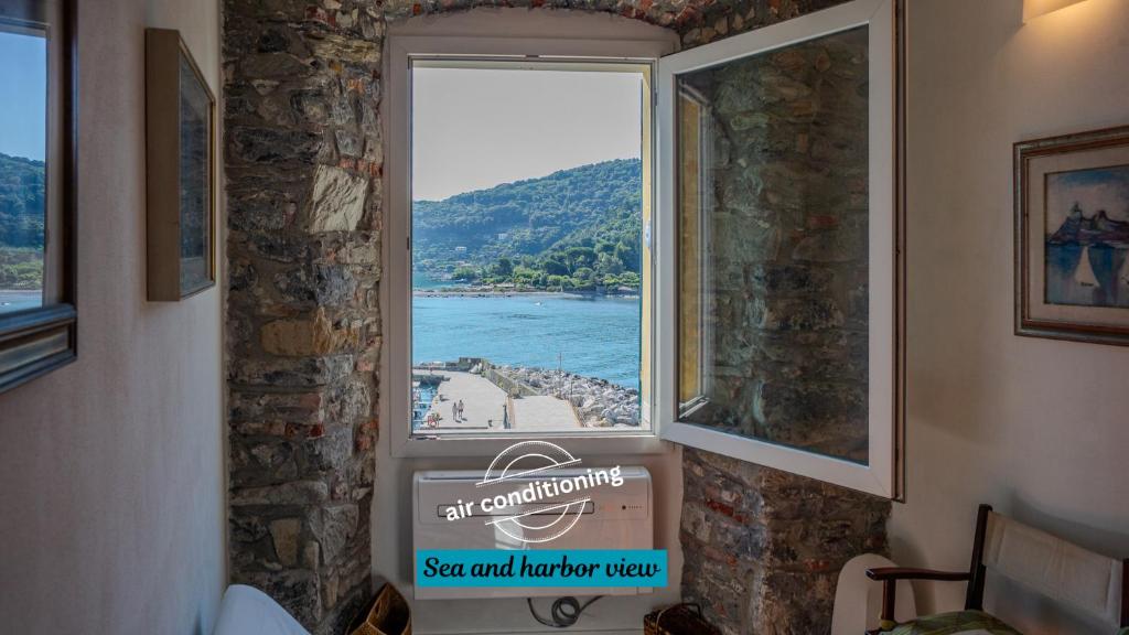 a window in a room with a view of the water at Il Sogno di Annetta in Portovenere