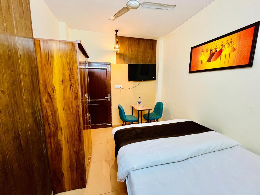 Postel nebo postele na pokoji v ubytování Kings Court Hotel Panchsheel Park