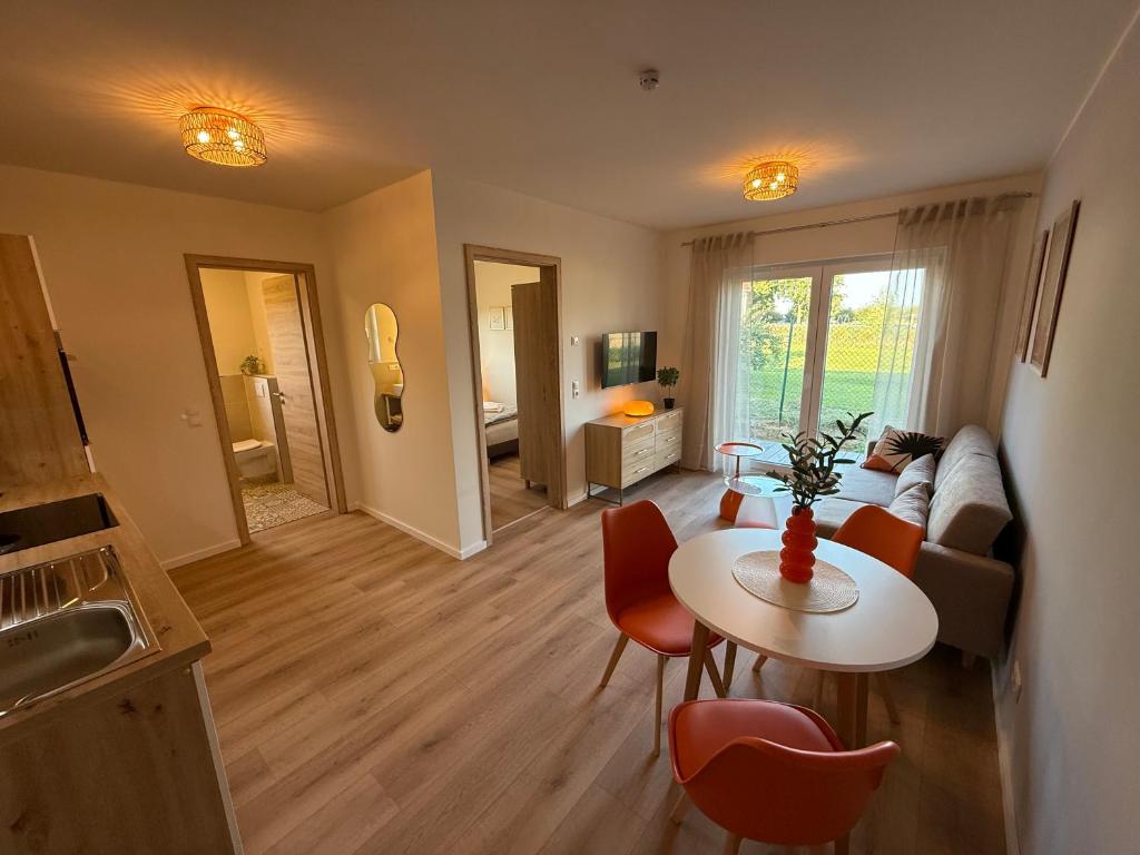 a living room with a couch and a table at Kamp 27 in Bebertal Zwei