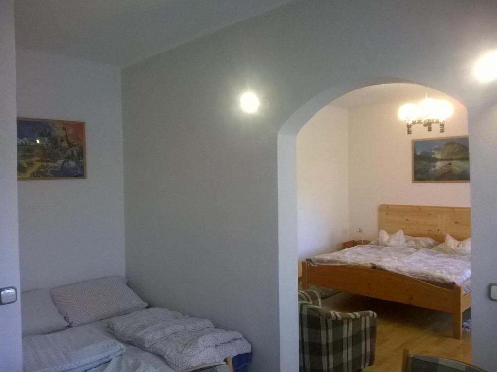 Posteľ alebo postele v izbe v ubytovaní Apartman Németh