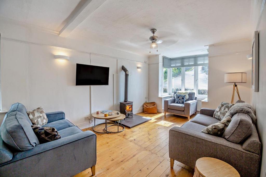 a living room with two couches and a tv at 3 Bed in Harlech oc-g33093 in Harlech