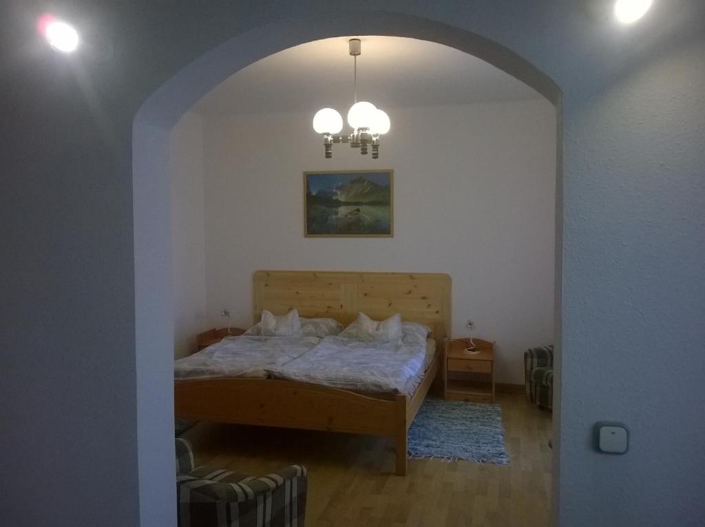Posteľ alebo postele v izbe v ubytovaní Apartman Németh