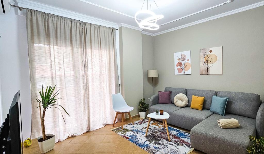 a living room with a couch and a table at Tirana Heart Lodge in Tirana