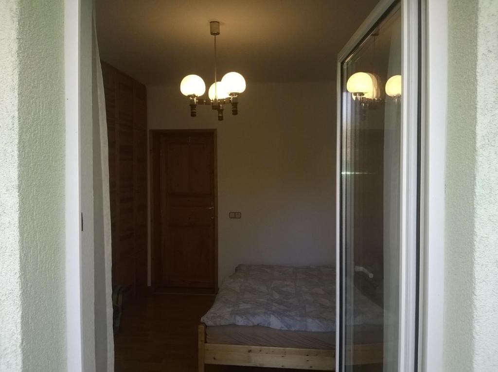 Posteľ alebo postele v izbe v ubytovaní Apartman Németh