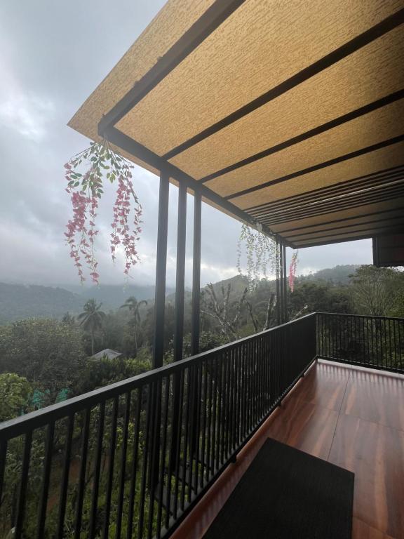 a balcony with a view of the mountains at Mount Lux Villa in Devāla