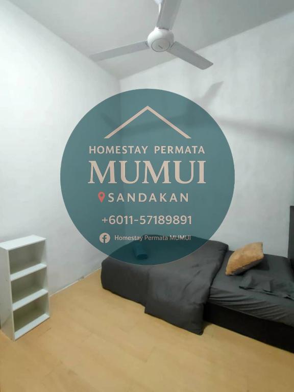 Postel nebo postele na pokoji v ubytování Homestay Permata Mumui