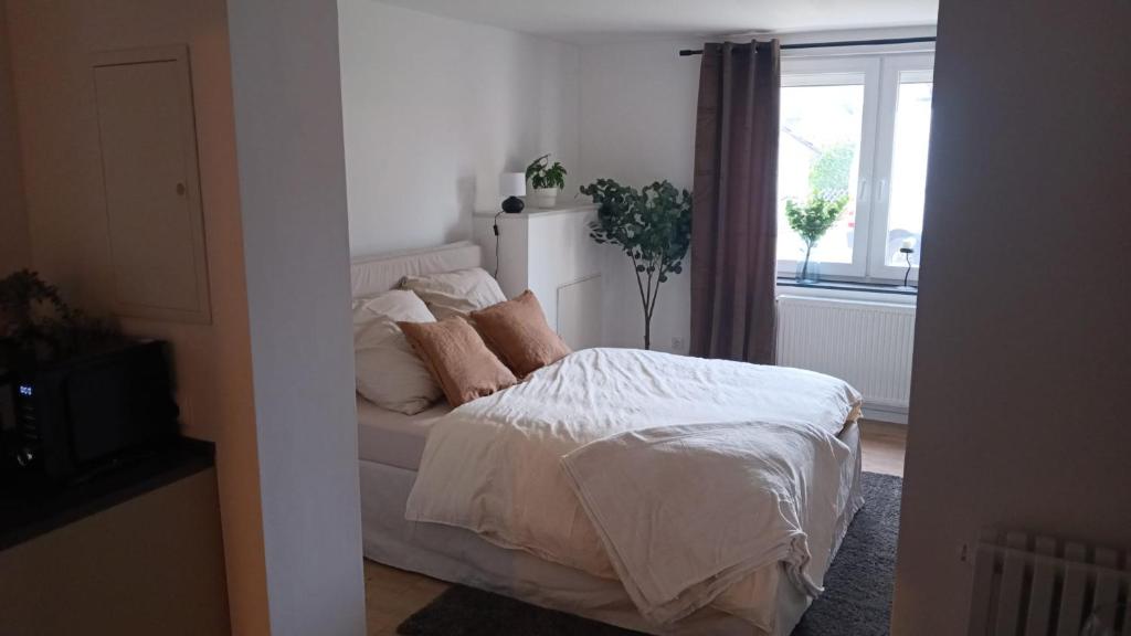 Ένα ή περισσότερα κρεβάτια σε δωμάτιο στο Apartment - Wohnung Bad Pyrmont