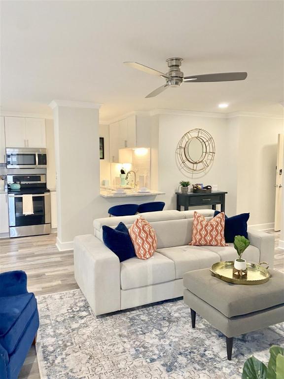 a living room with a white couch and a table at 8th Floor Stylish Downtown Condo Private Balcony in Atlanta