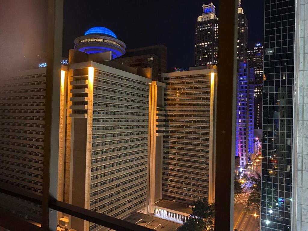 a view of a city skyline at night at 8th Floor Stylish Downtown Condo Private Balcony in Atlanta