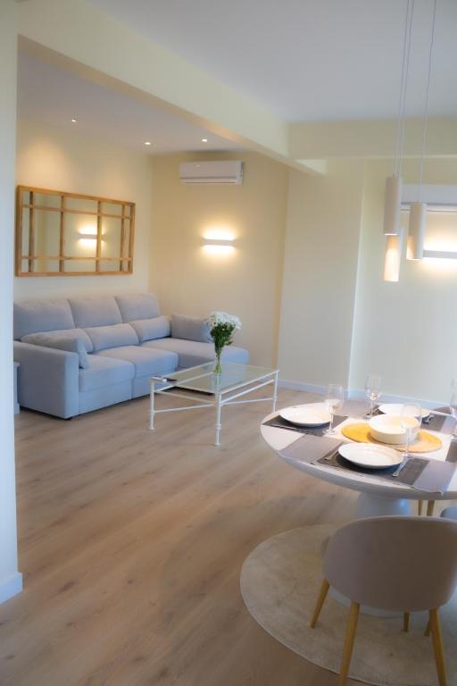 a living room with a couch and a table at Luminoso Bilbao in Bilbao