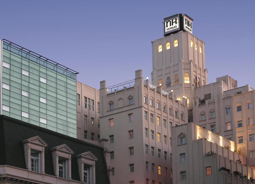 a building with a clock tower on top of it at NH City Buenos Aires in Buenos Aires