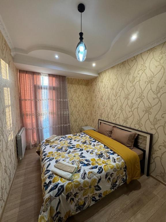 Postel nebo postele na pokoji v ubytování Tea's Condo in Saburtalo