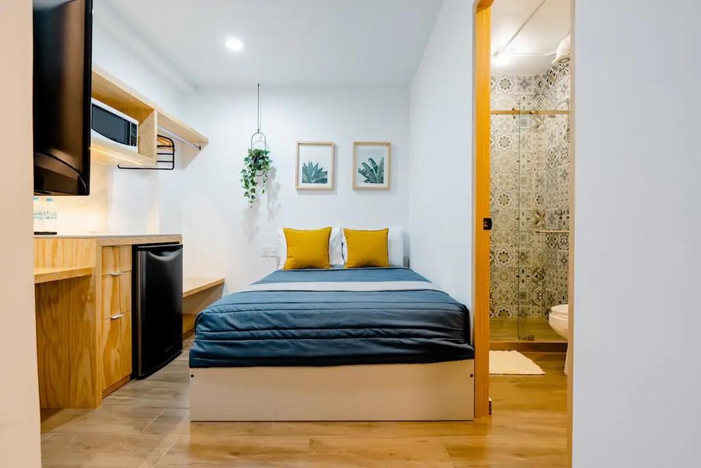 Llit o llits en una habitació de Aloja Rentals Mexico