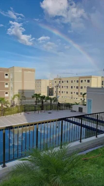 a rainbow in the sky over a body of water at Apartamento na Região do Grande Dirceu in Teresina
