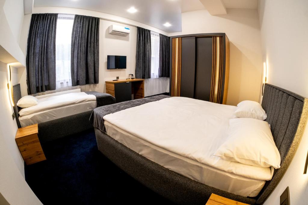 Postel nebo postele na pokoji v ubytování Hotel Urban Bliss